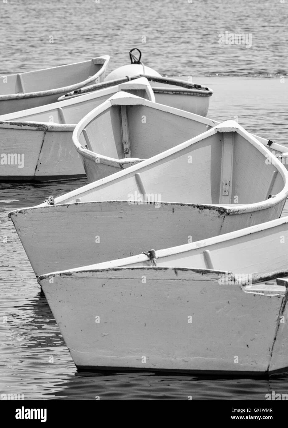 Lined up row of dinghies on Star Island in the Isles of Shoals, New Hampshire Stock Photo