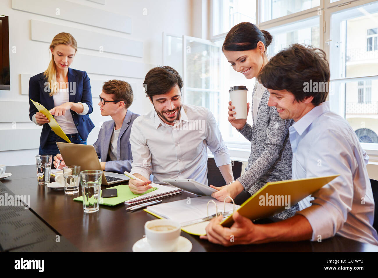 Start-up team discussing and cooperating in business meeting Stock Photo
