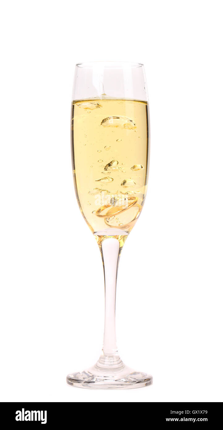 Wedding rings in a glass of champagne. Stock Photo