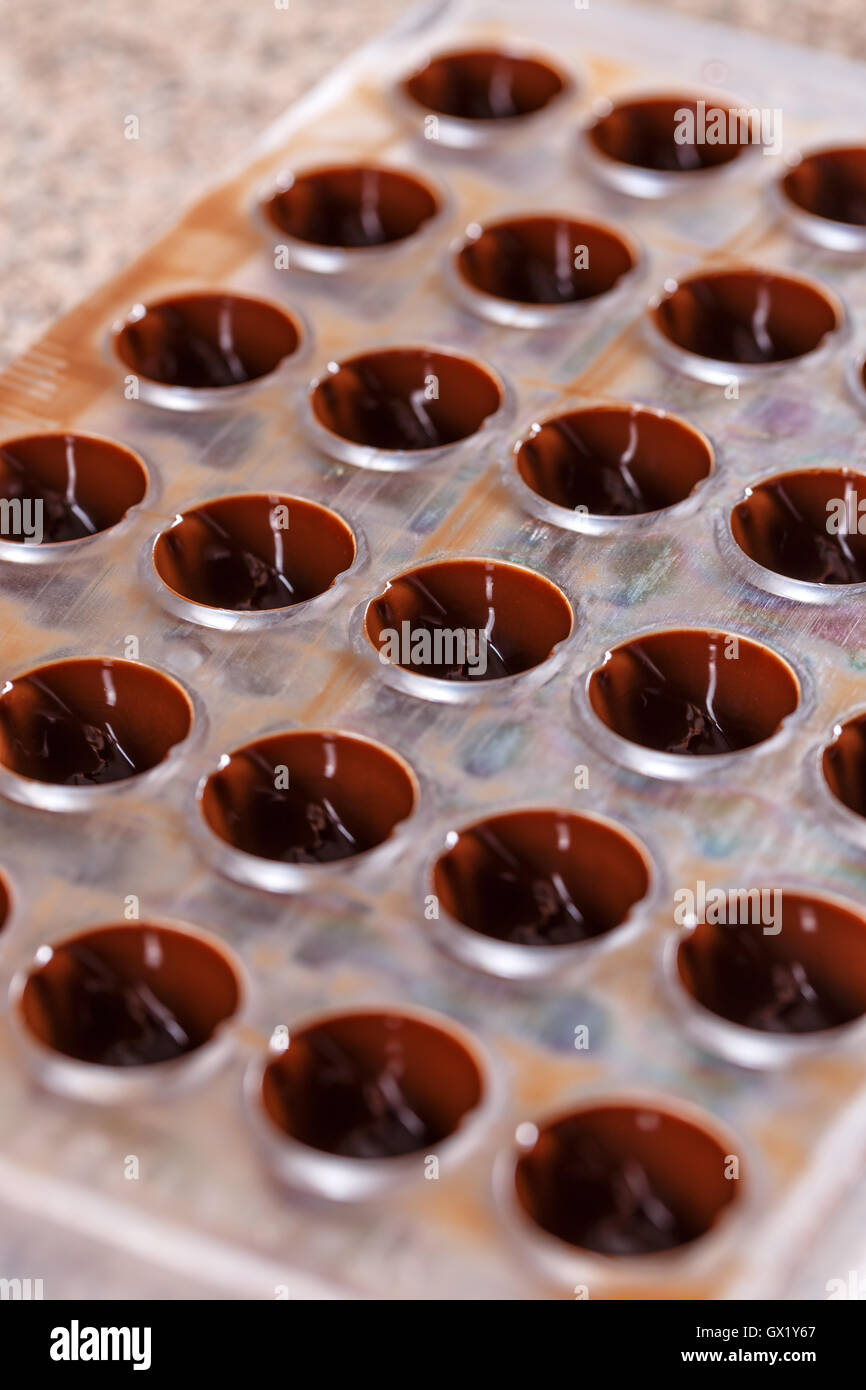 Making homemade sweets, chocolate in forms Stock Photo Alamy