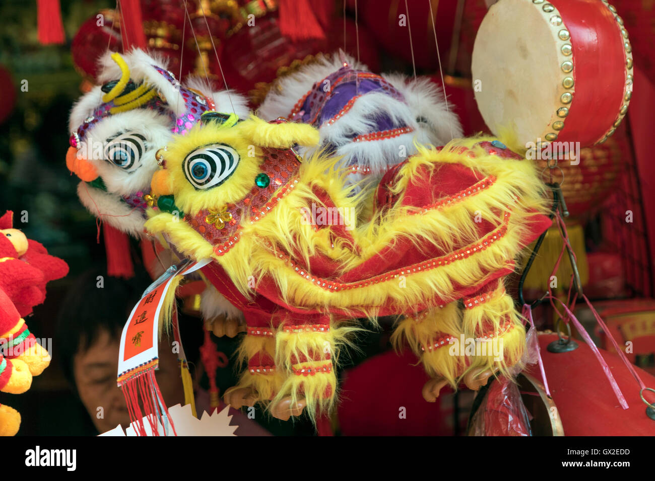 Toy lions on sale in souvenir shop in Singapore's Chinatown Stock Photo