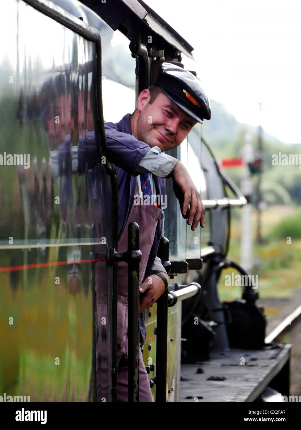 Engineer on a steam train at Goathland railway station Aidensfield North Yorkshire Moors England United Kingdom UK Great Britain Stock Photo