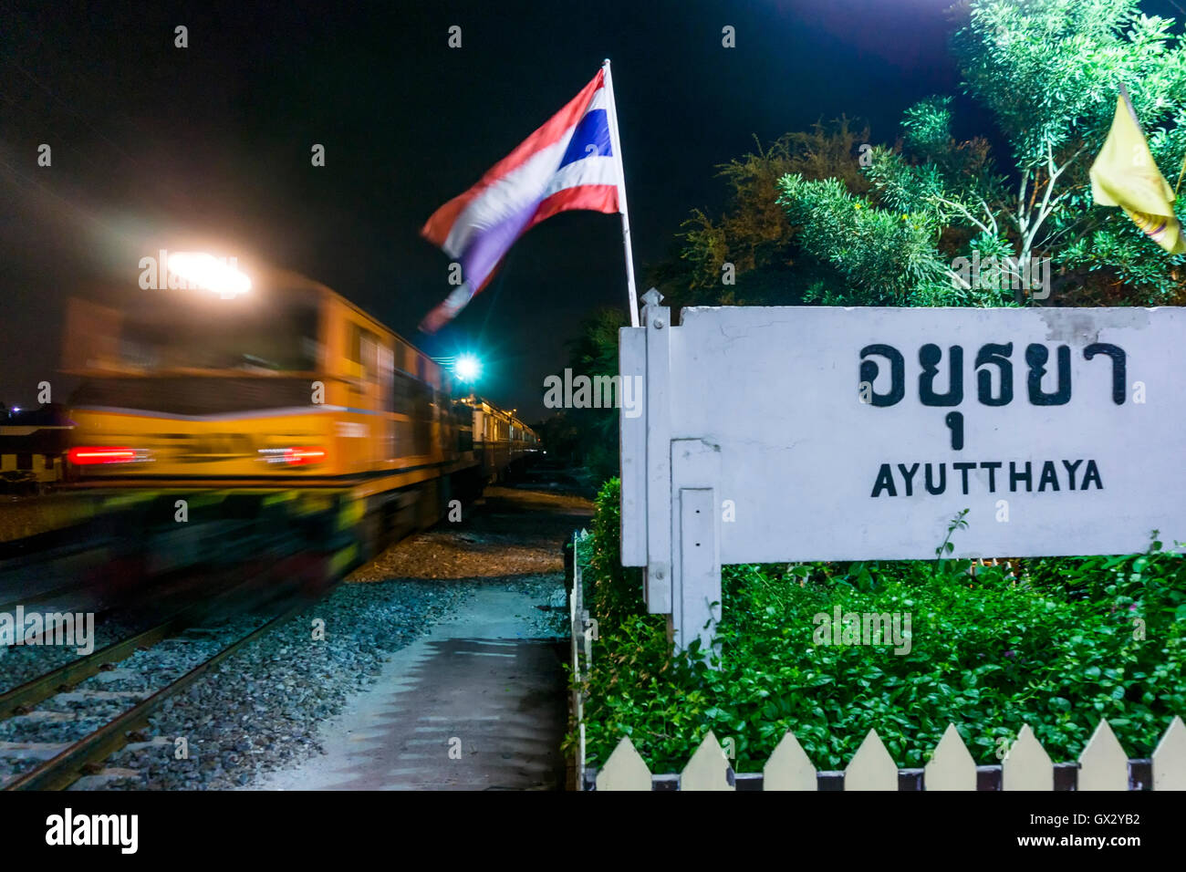 A Chiang Mai-Bangkok State Railway of Thailand (SRT) train leaving Ayutthaya railway station Stock Photo