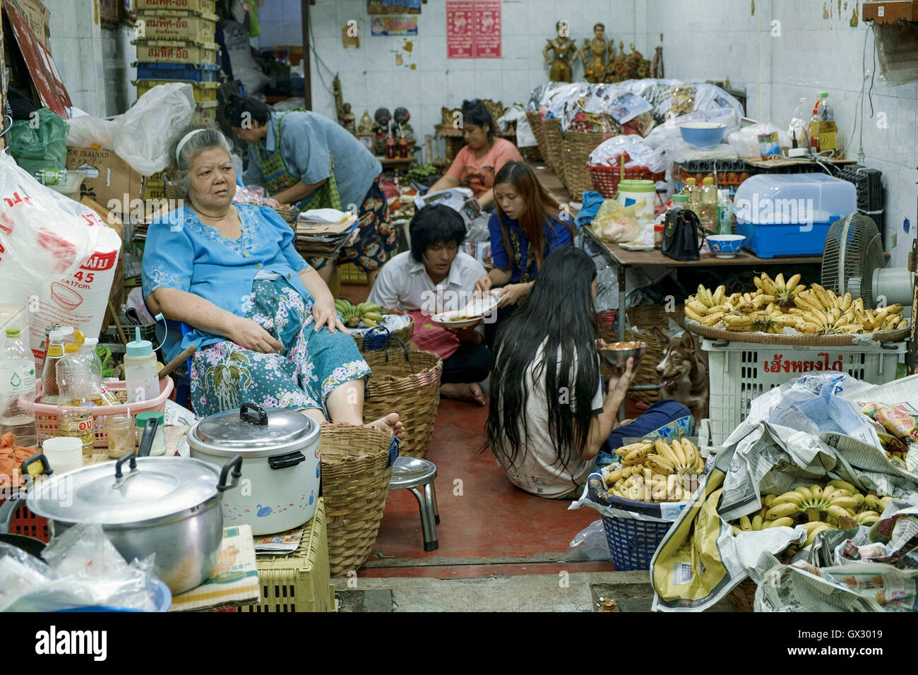 A family in a market shop in Bangkok's Chinatown, Thailand Stock Photo