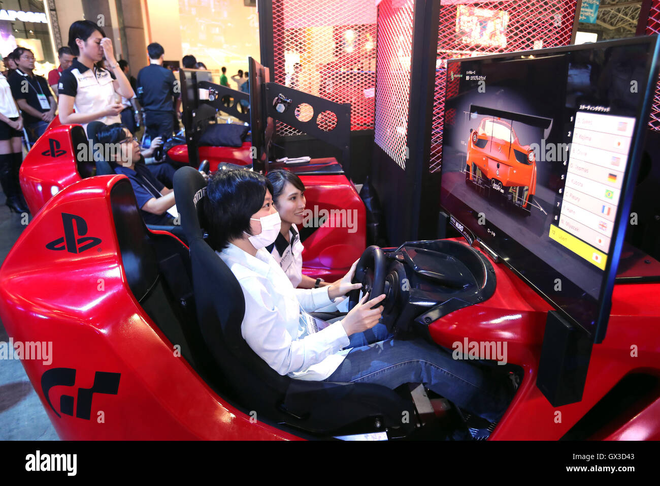 Thursday. 15th Sep, 2016. Visitors try to play videogames with Sony Interactive Entertainment's PlayStation 4 at the annual Tokyo Game Show in Chiba, suburban Tokyo on Thursday, September 15, 2016. The 20th anniversary Show includes show a new Virtual Reality (VR) area. The event hosts 614 exhibitors from 37 different countries and runs from September 15 to 18 at the International Convention Complex Makuhari Messe in Chiba. 1,523 game titles for smartphones, games consoles, PC and VR platforms are on show. Credit:  Yoshio Tsunoda/AFLO/Alamy Live News Stock Photo