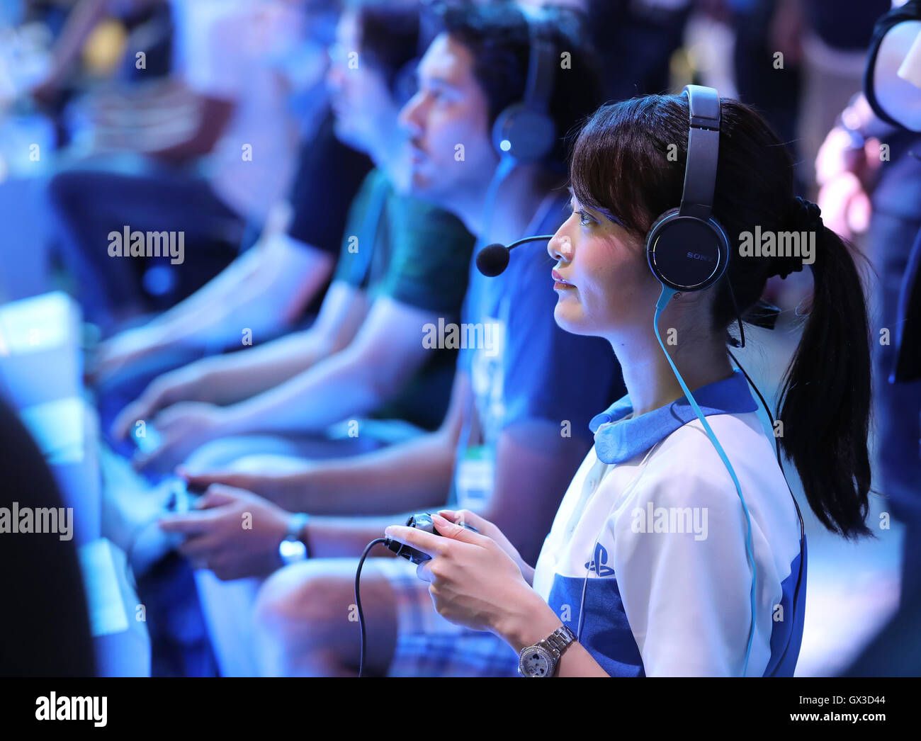 Thursday. 15th Sep, 2016. Visitors tries to play videogames with Sony Interactive Entertainment's PlayStation 4 at the annual Tokyo Game Show in Chiba, suburban Tokyo on Thursday, September 15, 2016. The 20th anniversary Show includes show a new Virtual Reality (VR) area. The event hosts 614 exhibitors from 37 different countries and runs from September 15 to 18 at the International Convention Complex Makuhari Messe in Chiba. 1,523 game titles for smartphones, games consoles, PC and VR platforms are on show. Credit:  Yoshio Tsunoda/AFLO/Alamy Live News Stock Photo