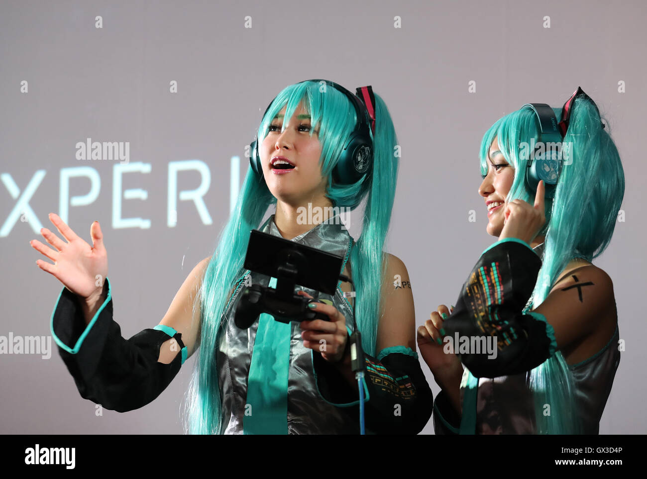 Thursday. 15th Sep, 2016. Models in costume of Hatsune Miku plays videogame with Sony's Xperia smartphone at the annual Tokyo Game Show in Chiba, suburban Tokyo on Thursday, September 15, 2016. The 20th anniversary Show includes show a new Virtual Reality (VR) area. The event hosts 614 exhibitors from 37 different countries and runs from September 15 to 18 at the International Convention Complex Makuhari Messe in Chiba. 1,523 game titles for smartphones, games consoles, PC and VR platforms are on show. Credit:  Yoshio Tsunoda/AFLO/Alamy Live News Stock Photo