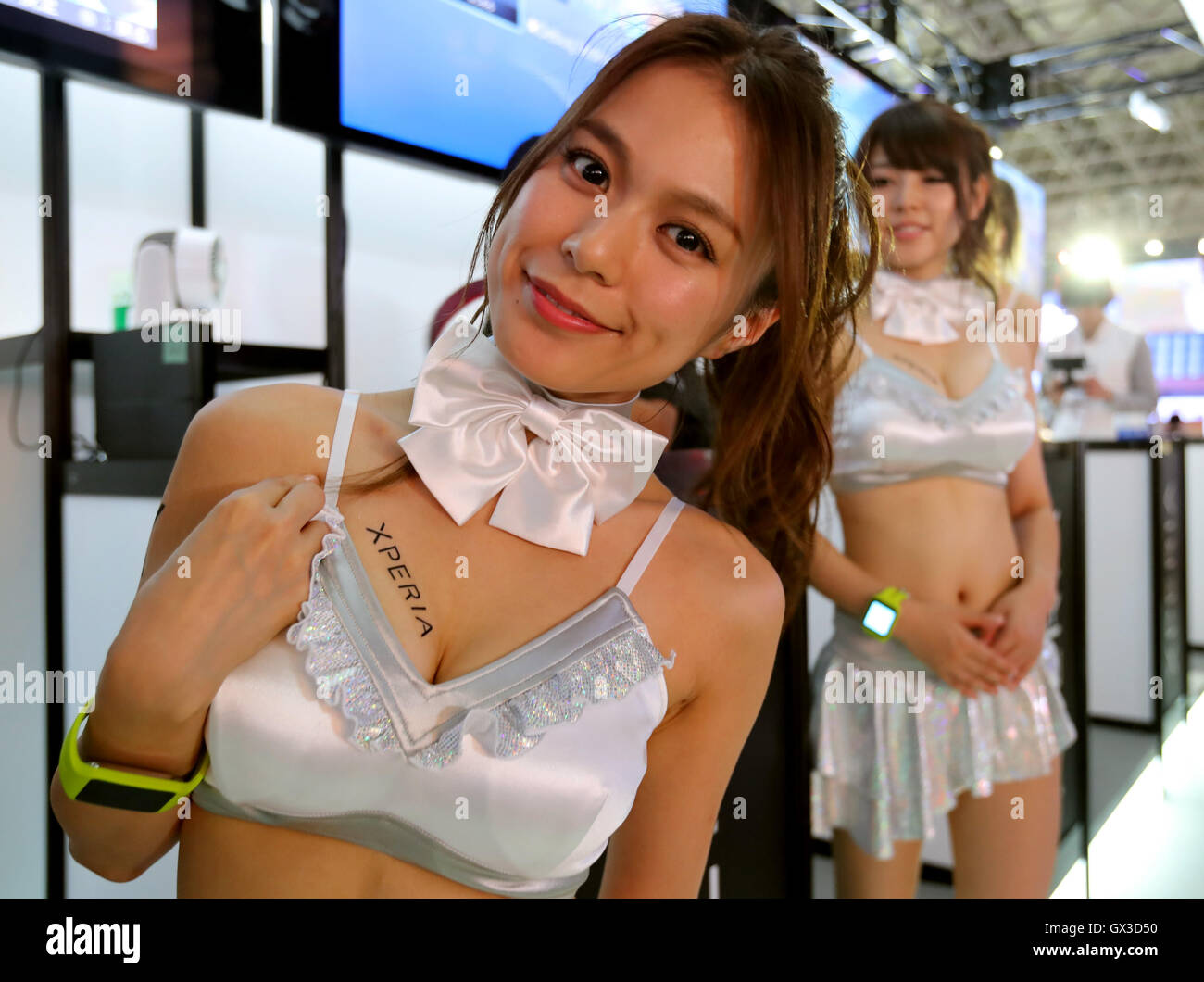 Thursday. 15th Sep, 2016. A model puts a sticker of Sony's Xperia smartphone on her body for the promotion at the annual Tokyo Game Show in Chiba, suburban Tokyo on Thursday, September 15, 2016. The 20th anniversary Show includes show a new Virtual Reality (VR) area. The event hosts 614 exhibitors from 37 different countries and runs from September 15 to 18 at the International Convention Complex Makuhari Messe in Chiba. 1,523 game titles for smartphones, games consoles, PC and VR platforms are on show. Credit:  Yoshio Tsunoda/AFLO/Alamy Live News Stock Photo