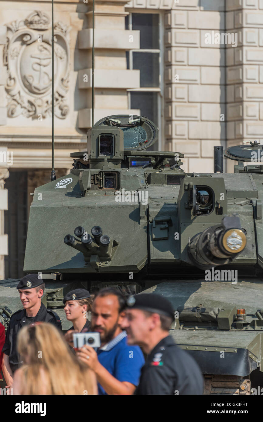 London, UK. 15th September, 2016. A current Challenger tank of the Royal Tank regiment awits the arrival of the WWI sister on Horse Guards Parade - A replica of a World War One tank brought to London to mark the 100th anniversary its first use in action in the Battle of the Somme on 15 September 1916. Dorset's Tank Museum, provided the machine which was designed to travel at walking pace (3mph) to support the infantry. Credit:  Guy Bell/Alamy Live News Stock Photo