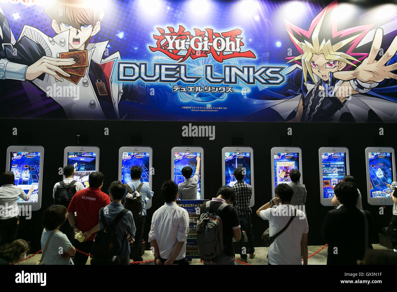 Tokyo, Japan. 16th September, 2016. Visitors line up to play Yu-Gi-Oh! video game at the Tokyo Game Show on September 16, 2016, Chiba, Japan. The 20th anniversary show has added a new Virtual Reality (VR) area where 35 companies will exhibit. The event which calls itself the hub of the global video game market is hosting 614 exhibitors from 37 different countries and runs from September 15 to 18 at the International Convention Complex Makuhari Messe in Chiba. 1,523 game titles for smartphones, games consoles, PC and VR platforms are on show.  Stock Photo
