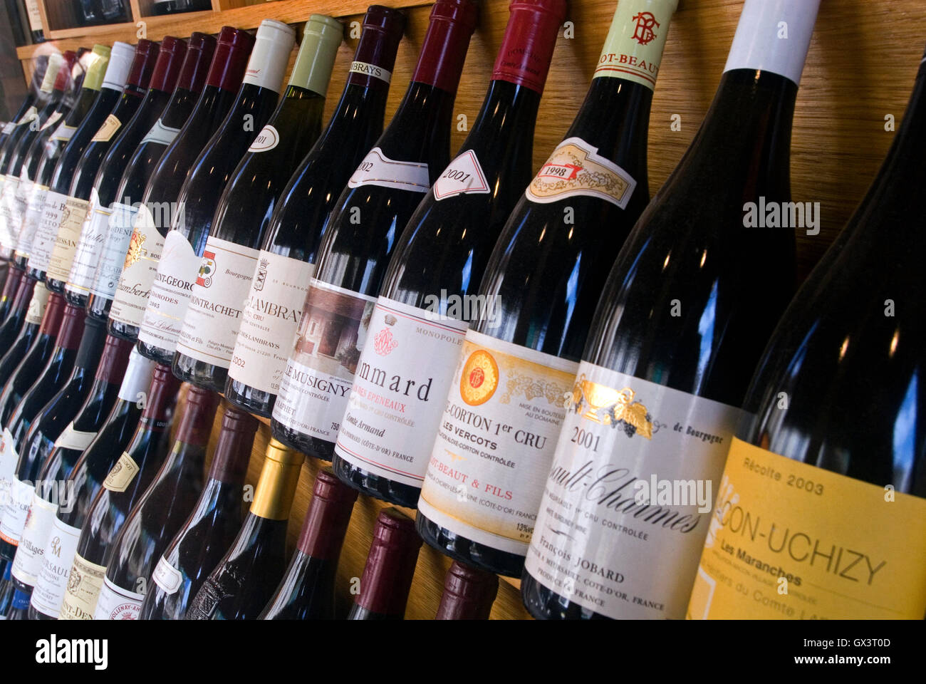 Variety of fine Burgundy wine bottles on display for sale at JeanLuc