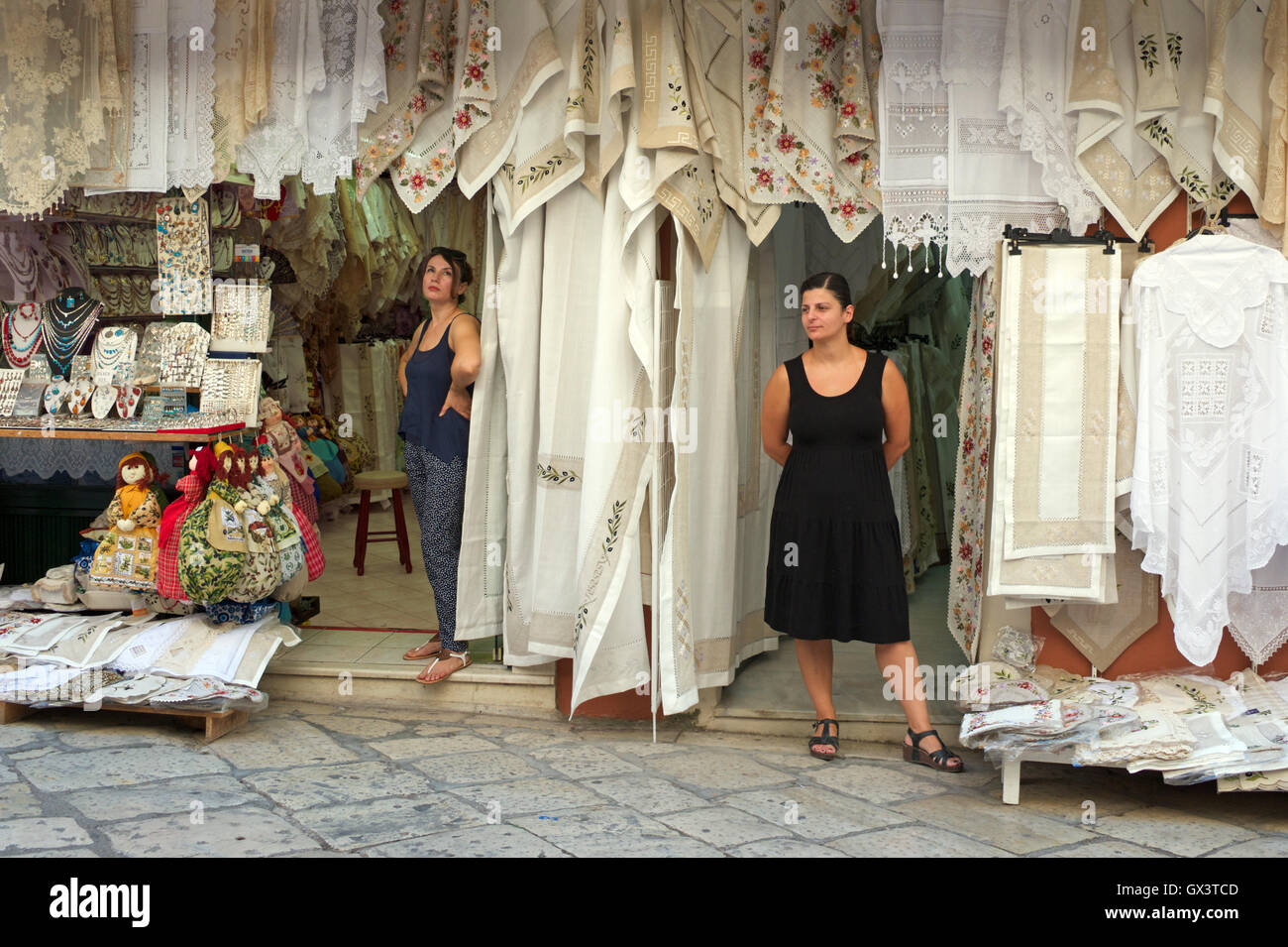 Lace shops with female shopkeepers waiting for trade Corfu Old Town Ionian Islands Greece Stock Photo