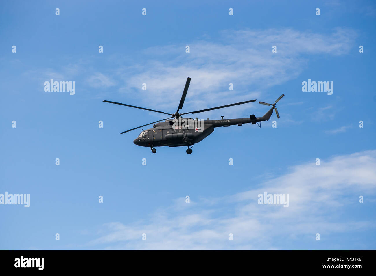 Russian military helicopter MI-8 in the blue sky Stock Photo - Alamy