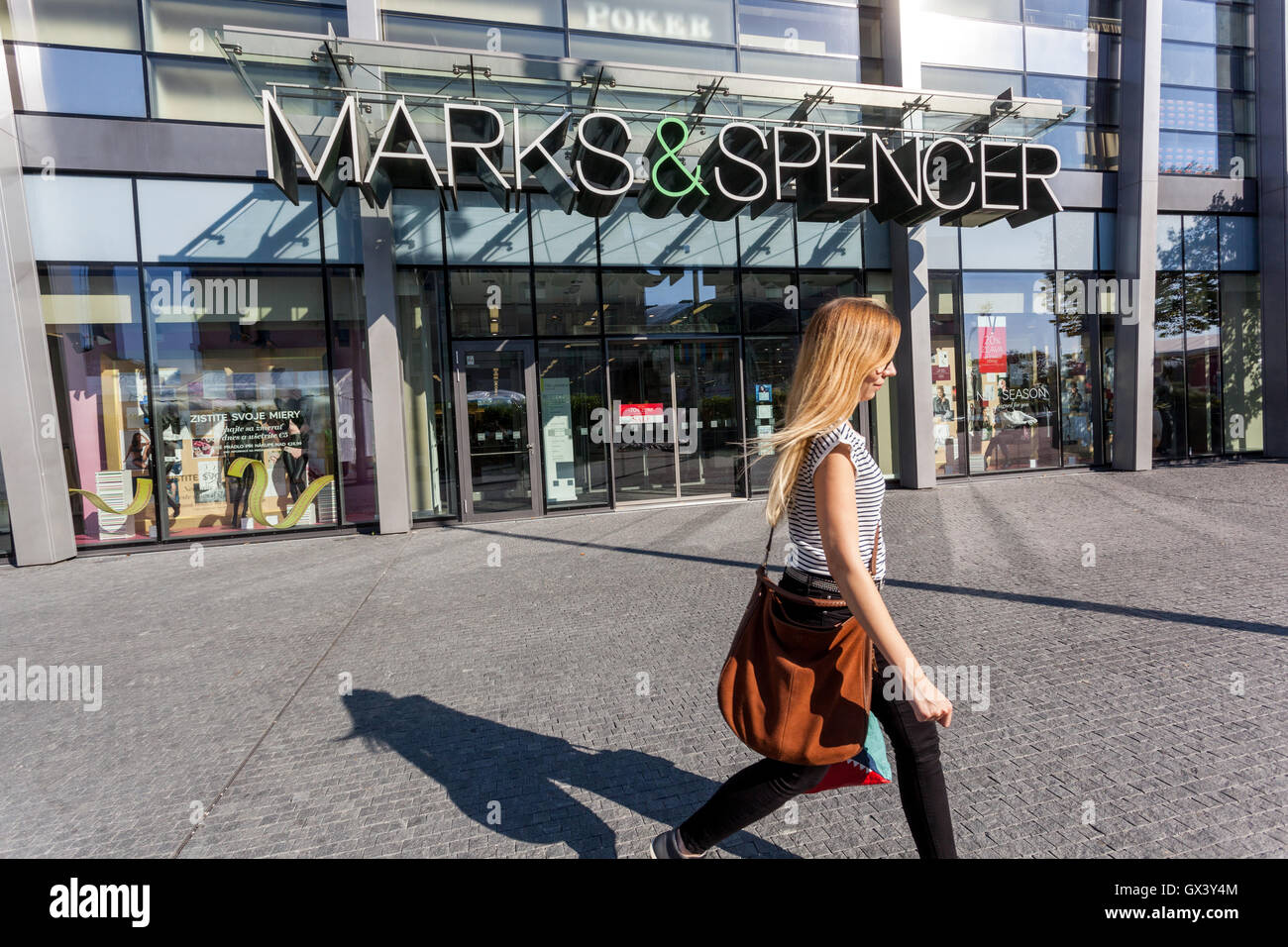 Shopping center Eurovea, Marks & Spencer store, Bratislava, Slovakia, Europe Young Woman Walking Street Stock Photo