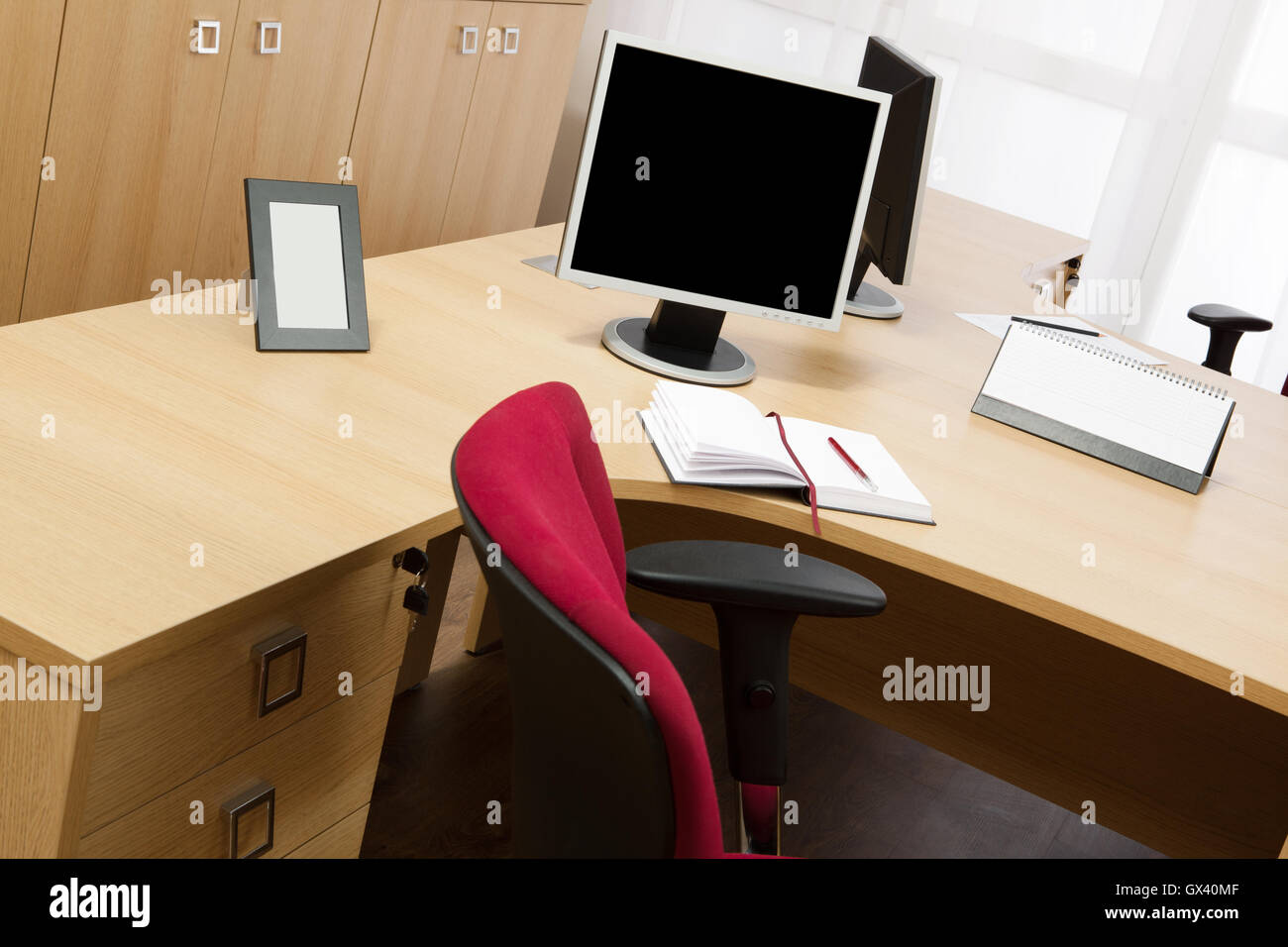 monitors on the desks in a modern office Stock Photo Alamy