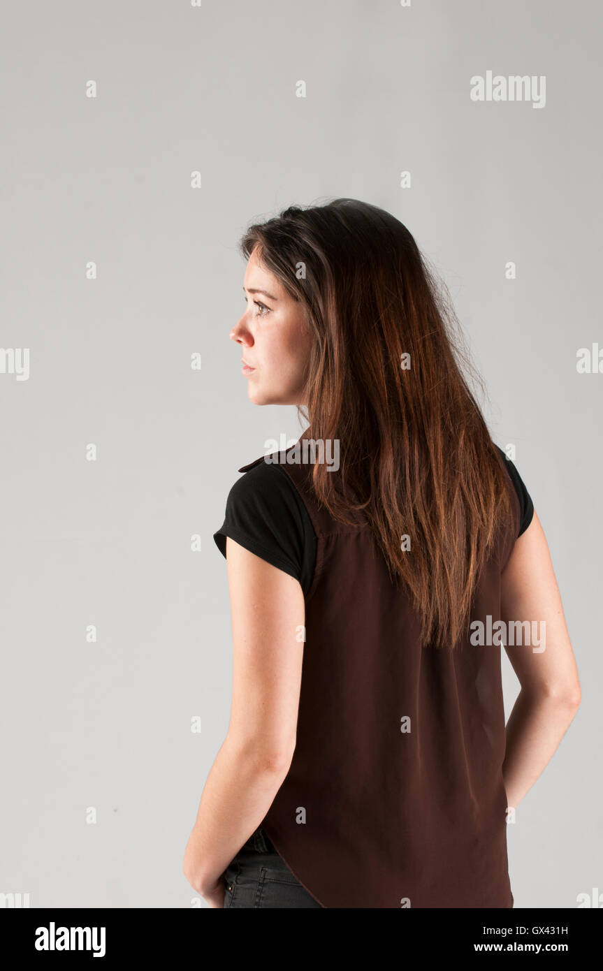 Rear view of a teenage girl looking away Stock Photo - Alamy