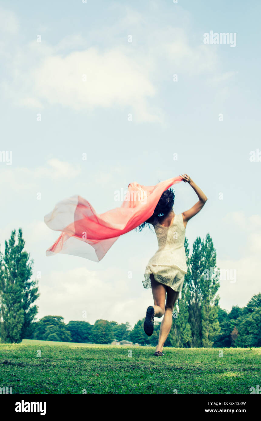 Woman running rear view dress hi-res stock photography and images - Alamy