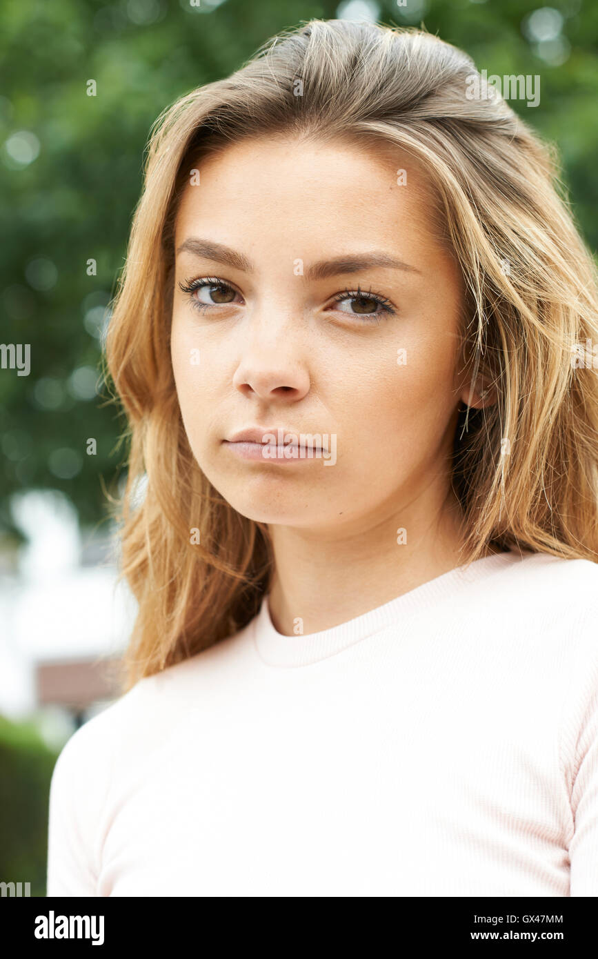 Head And Shoulders Portrait Of Serious Teenage Girl Stock Photo Alamy