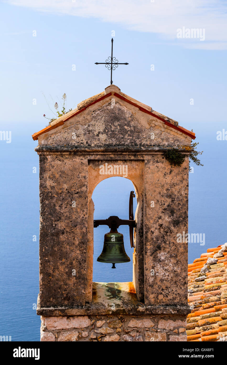 Red roof chapel cross with Mediterranean sea view at the French Riviera. Stock Photo