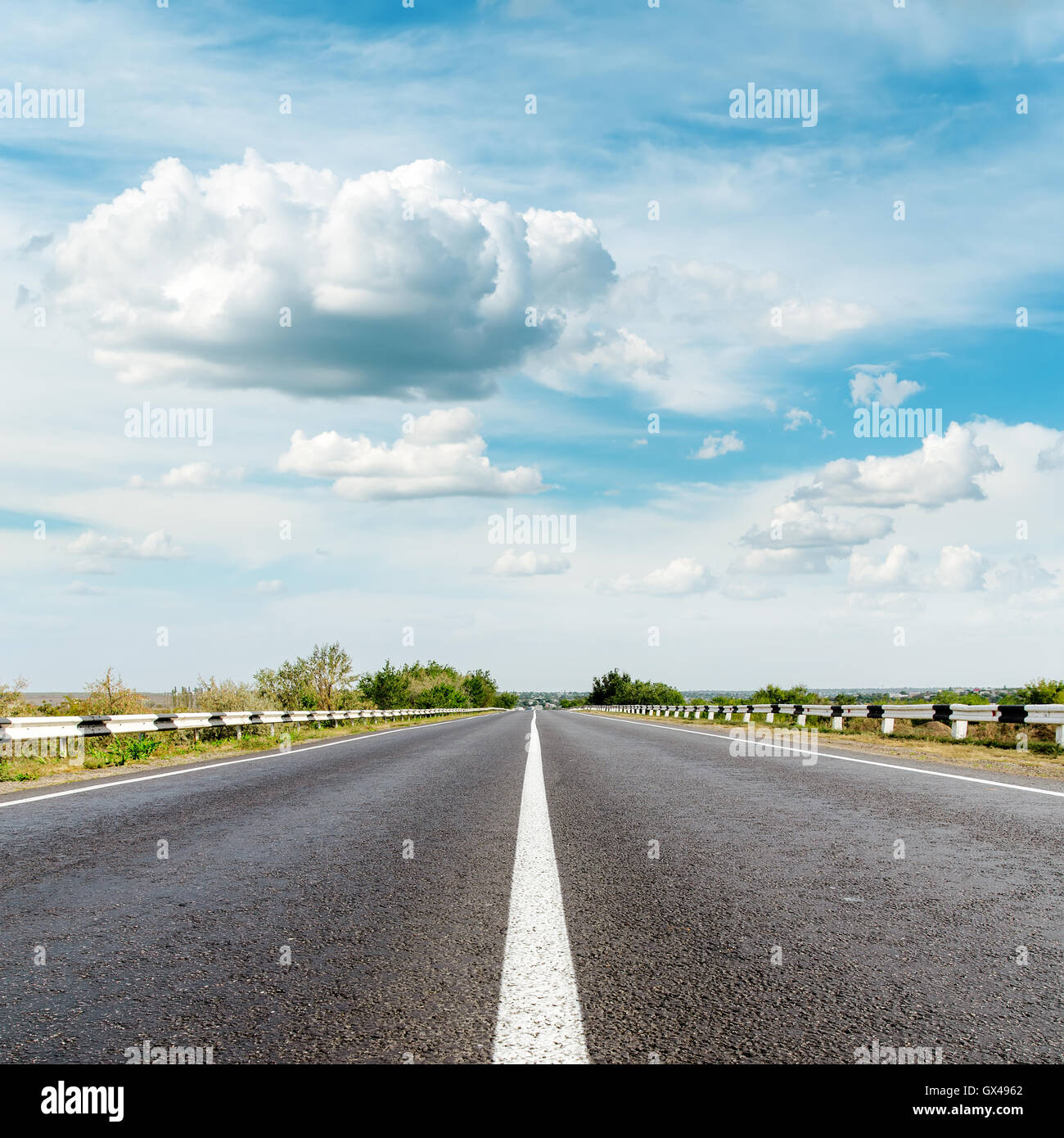 asphalt road and clouds over it Stock Photo - Alamy