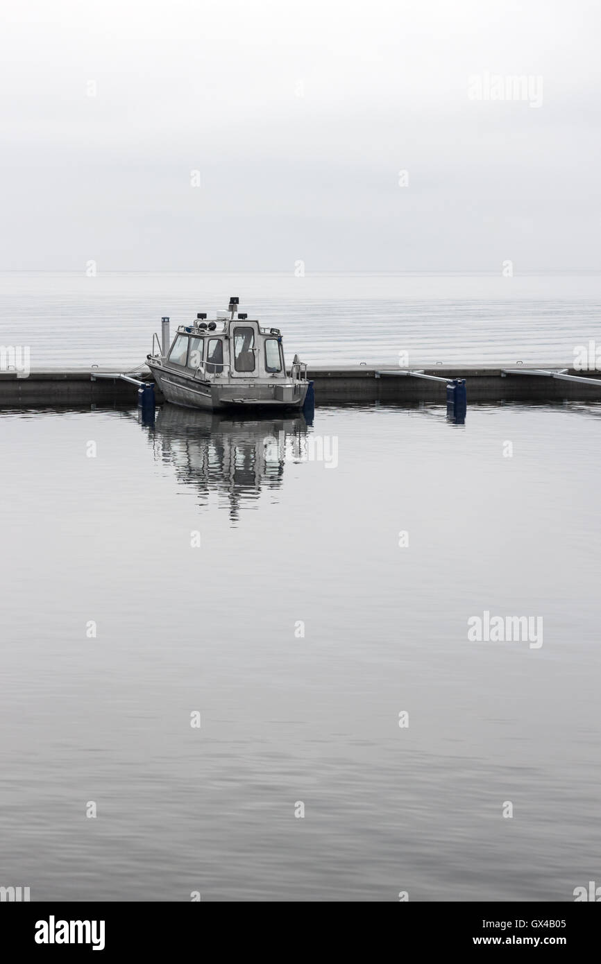 Solitary boat in sea hi-res stock photography and images - Alamy