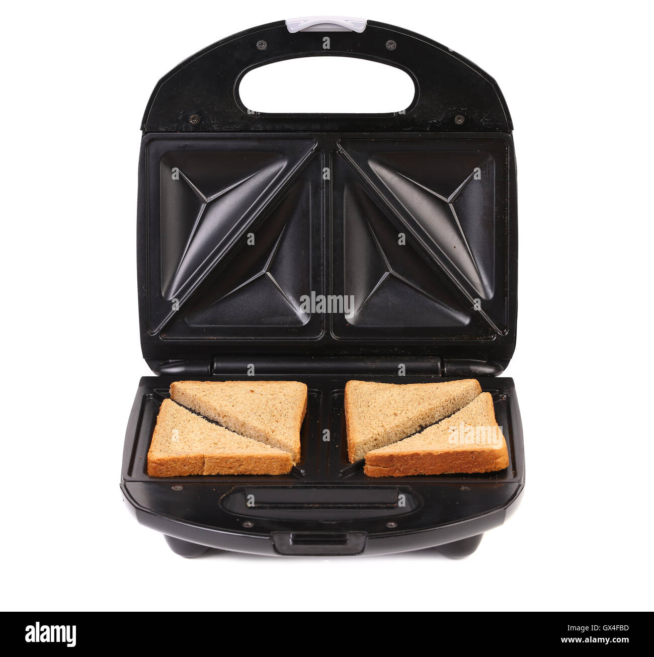 Sandwich toaster with bread slices. Stock Photo