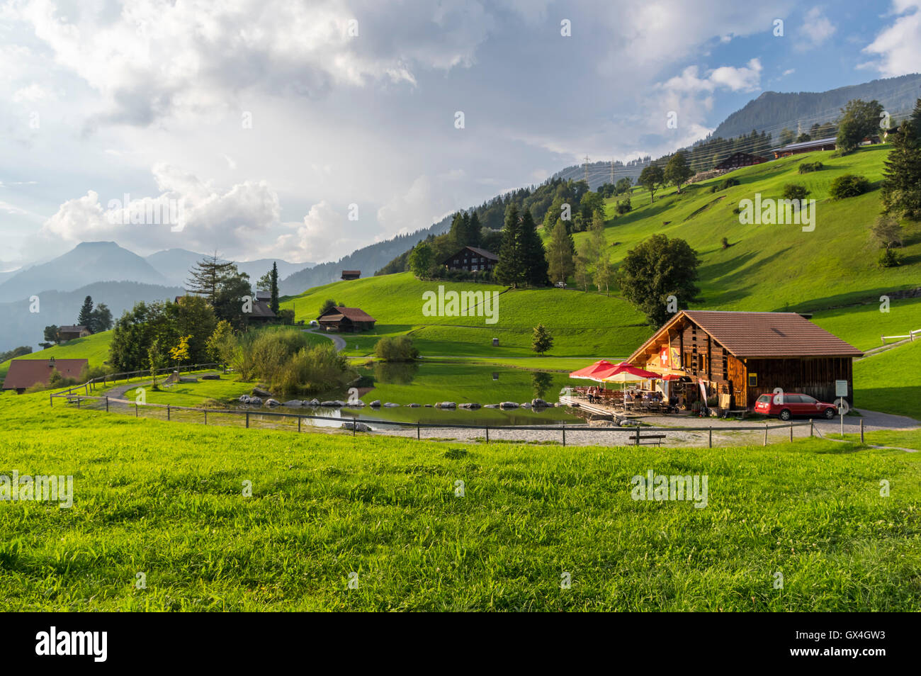 Small bathing lake in Hasliberg in the Swiss Alps. Stock Photo