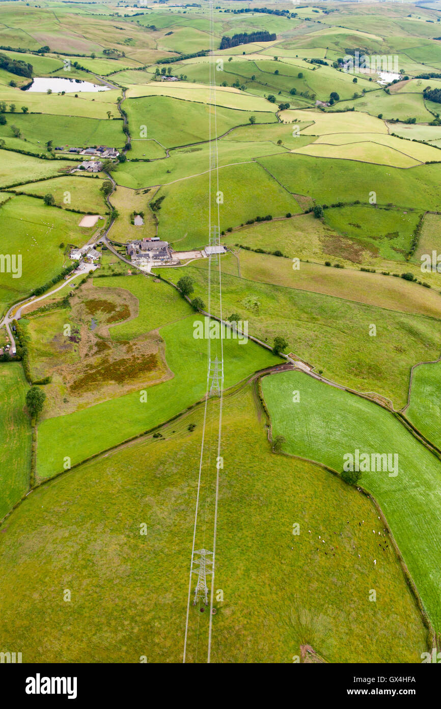 Aerial view of powerlines going through farmland in Cumbria near Kirkby Lonsdale England Stock Photo