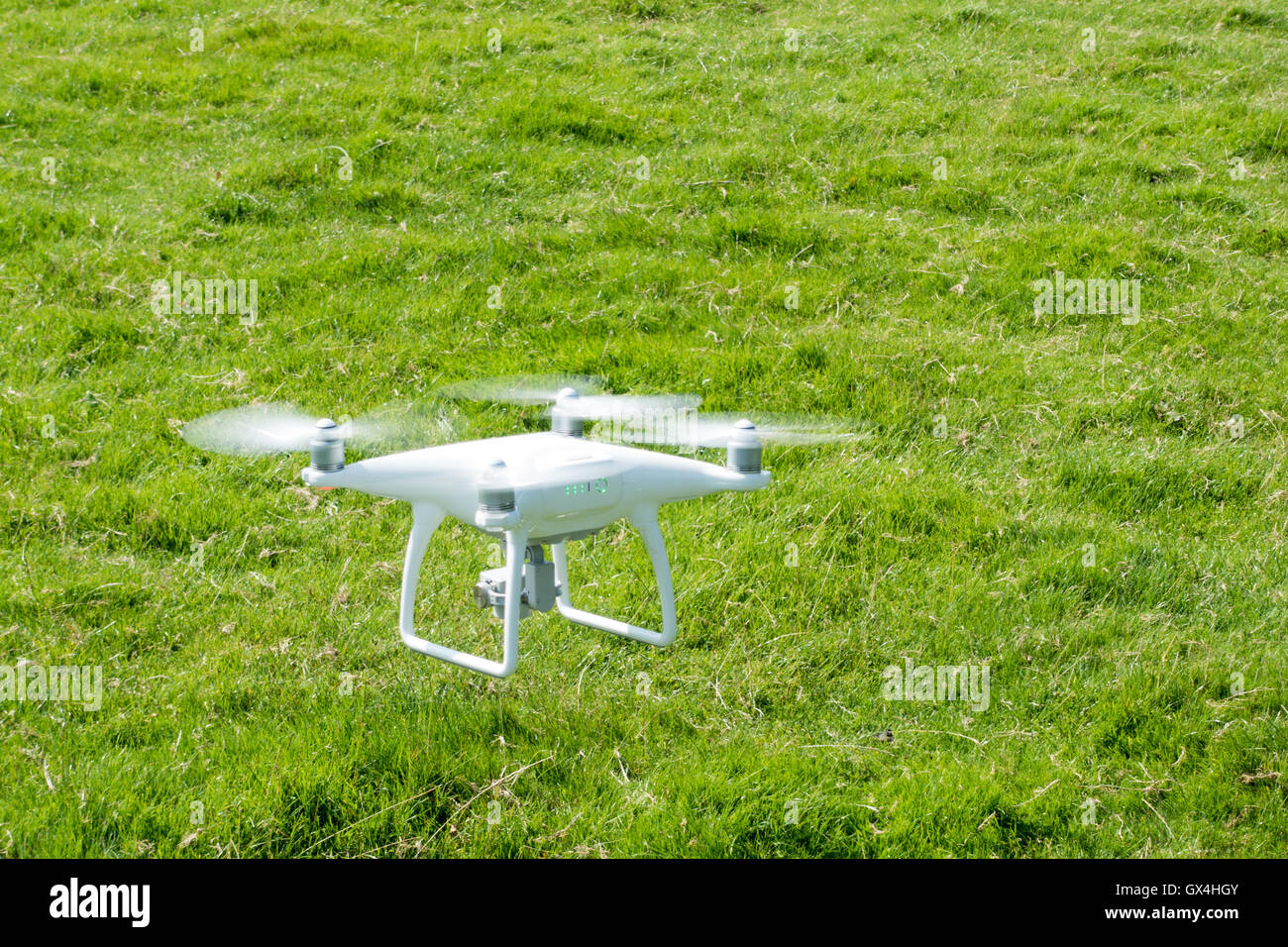 DJI Phantom 4 UAV Drone in flight Stock Photo