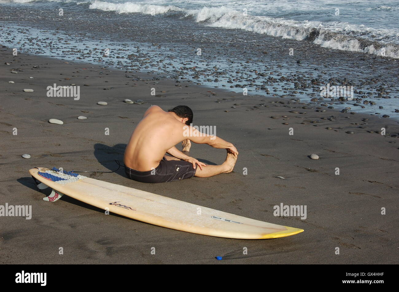 Surfer warming-up Stock Photo