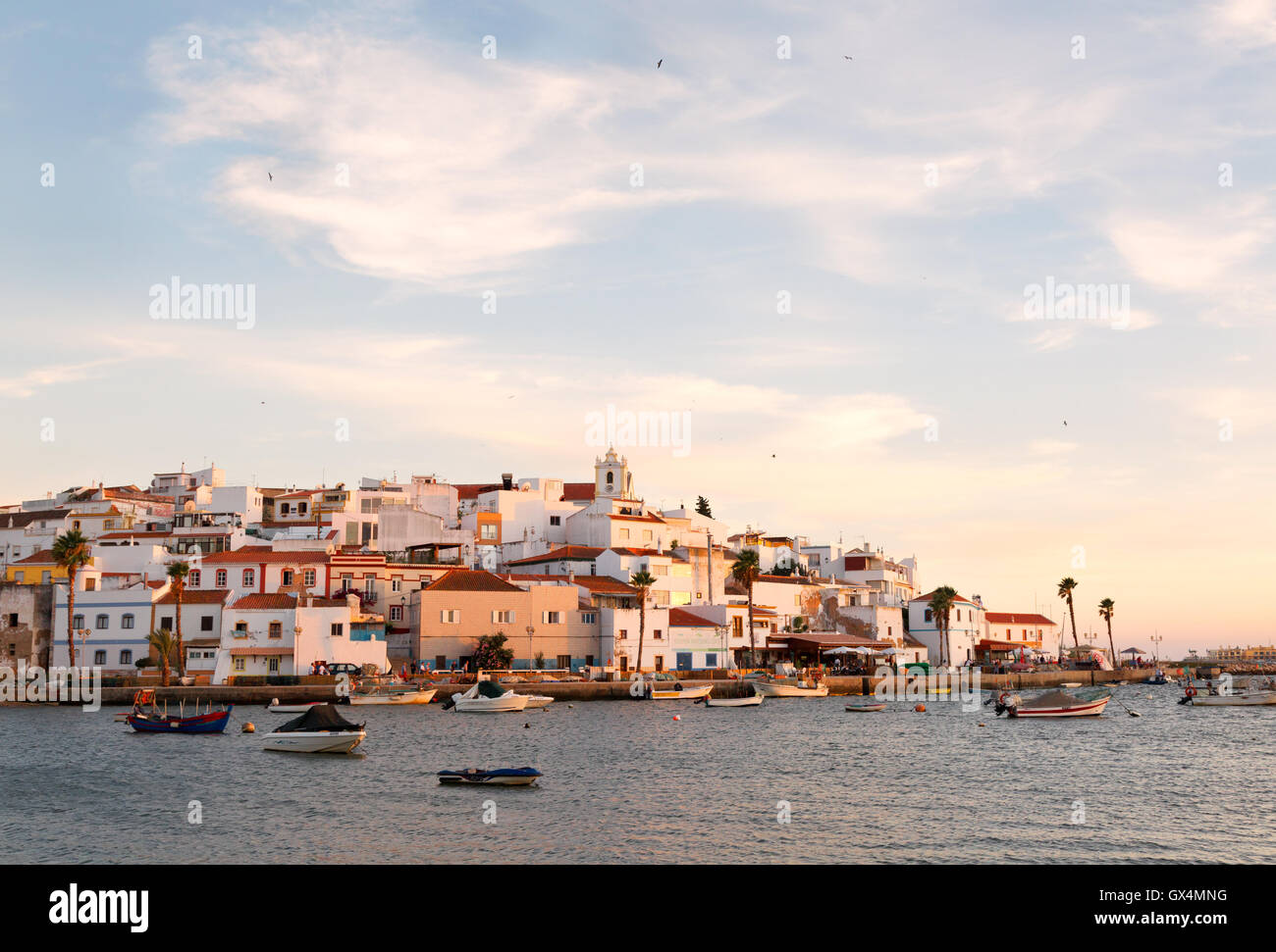 Ferragudo fishing village at sunset, Ferragudo, the Algarve Portugal Europe Stock Photo