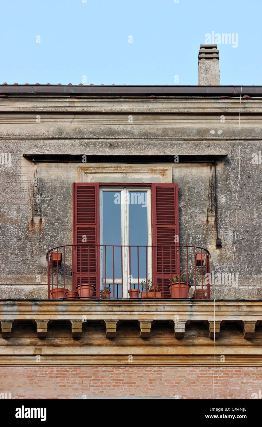 a beautiful elegant, old and brightly coloured window with balcony in Frascati, Italy, windows, shutters Stock Photo