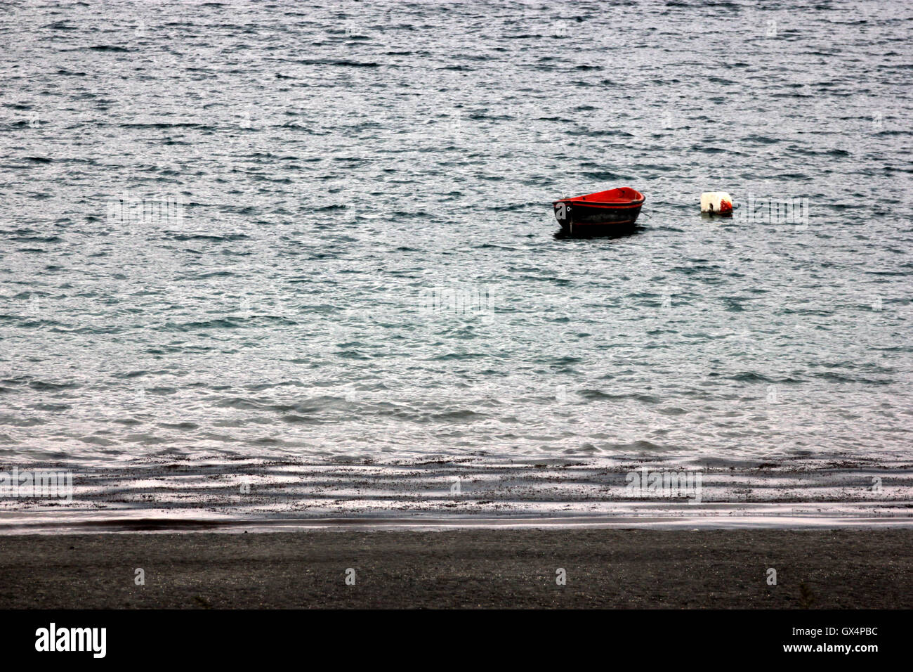 a red boat near the shore of  the lake, lago di Albano, Castel Gandolfo, Italy Stock Photo