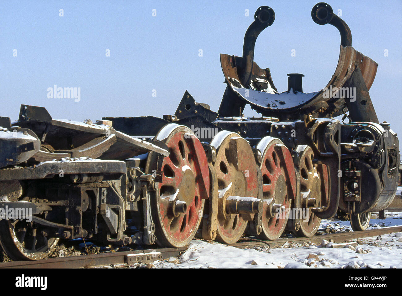 The locomotive scrapyard at Manzhouli with the remains of another JF Class Mikado, February 1987. Stock Photo
