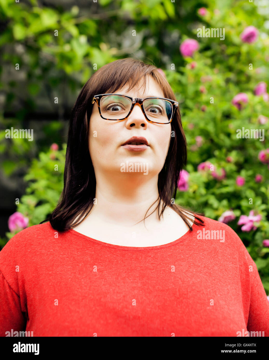 pretty modern mature fat woman outside wearing glasses Stock Photo - Alamy