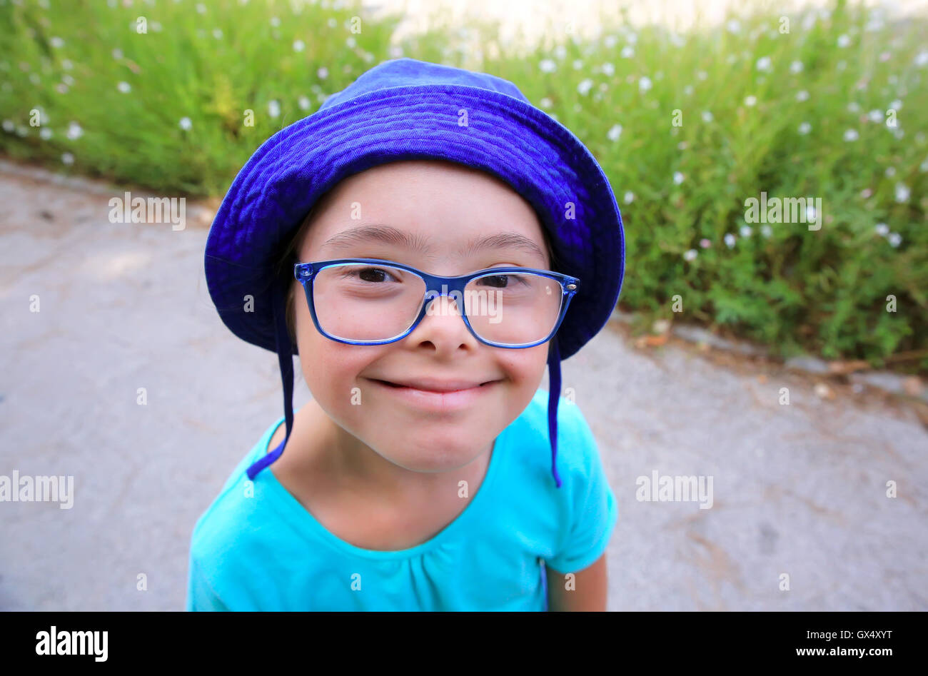 Little girl smiling outside Stock Photo