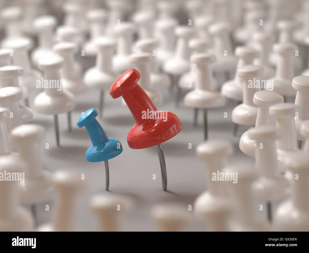3D illustration. Red pin intimidating the blue pin. Bullying concept or harassment on the workplace. Stock Photo