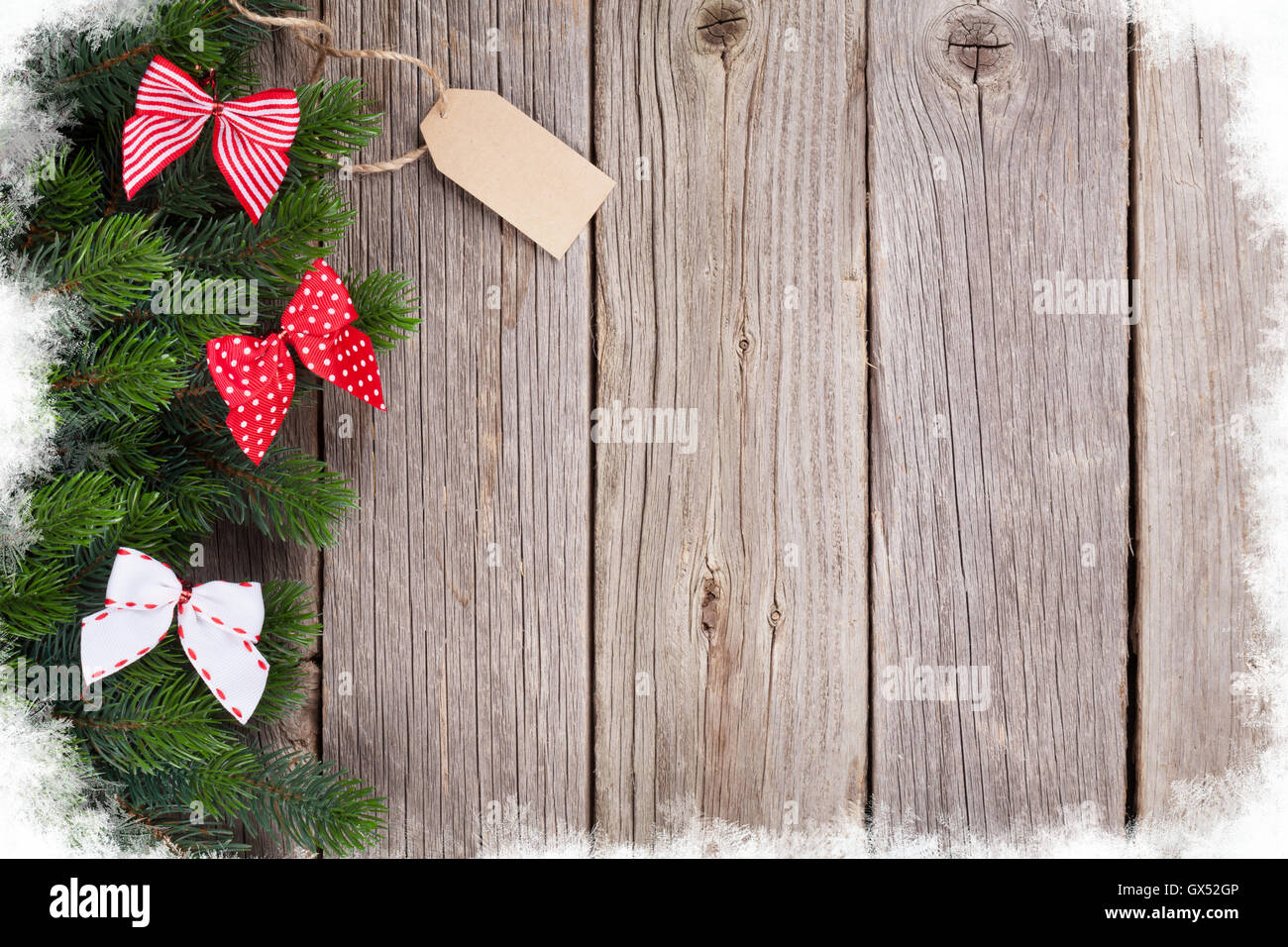 Christmas wooden background with fir tree and ribbon bow decor. View ...