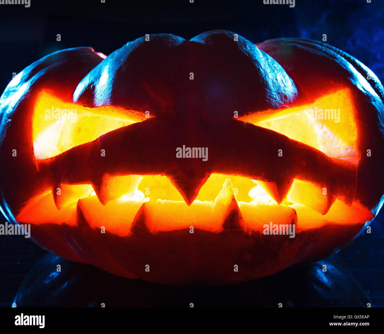 Halloween - old jack-o-lantern on black background Stock Photo