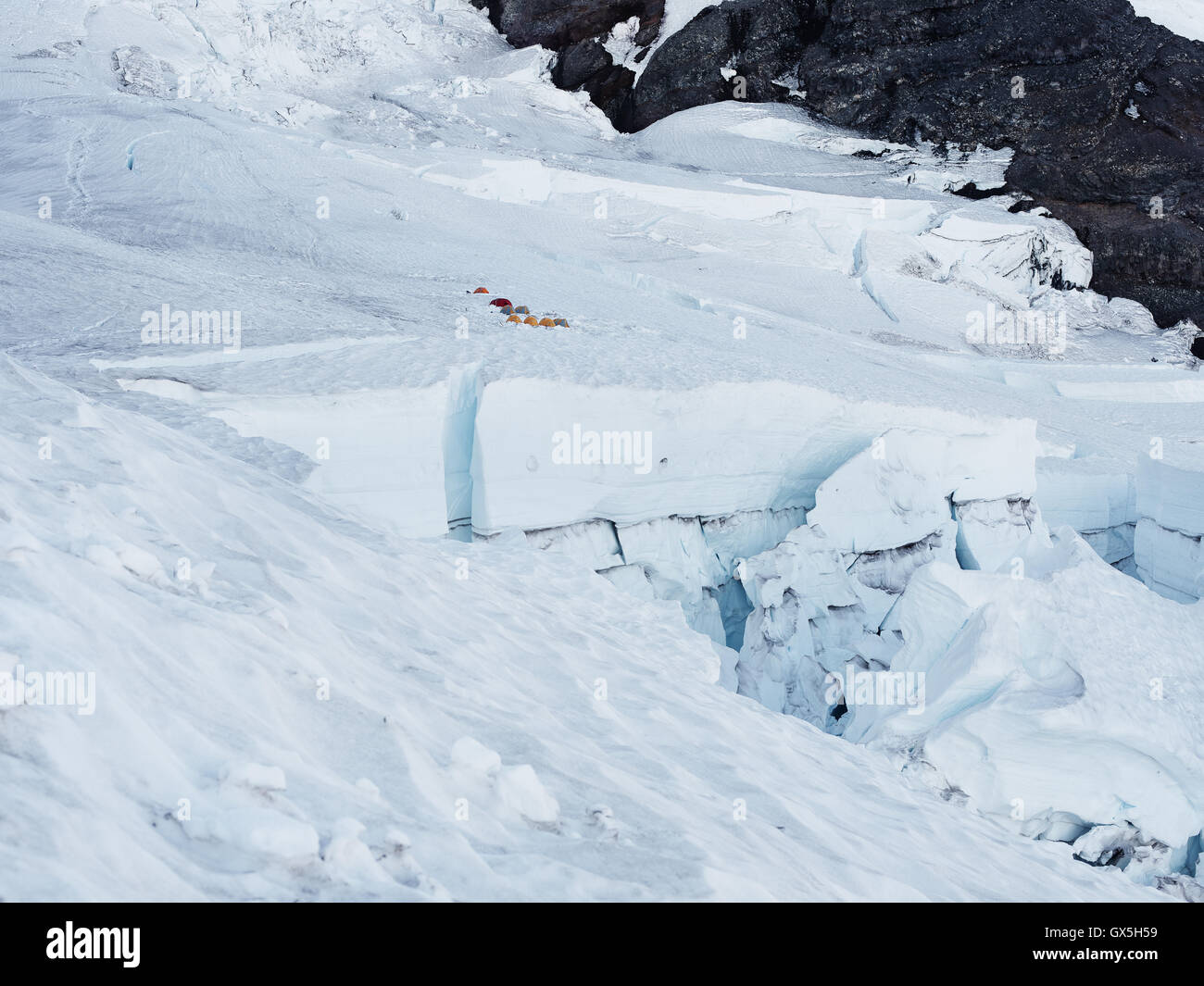 Tents set up on snow as hikers make their trek up Washington's Mt. Rainier. Stock Photo