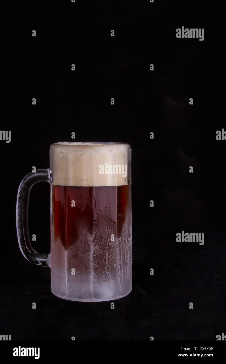 A frosty mug of beer with a head of foam Stock Photo Alamy