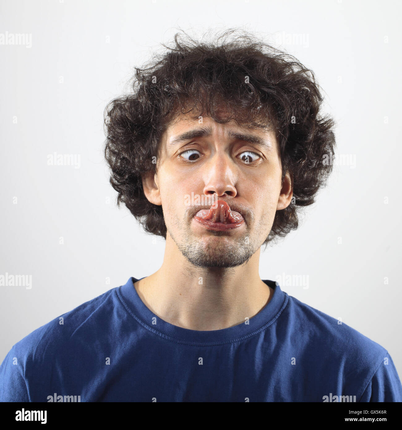 Portrait of a crazy young men. Stock Photo