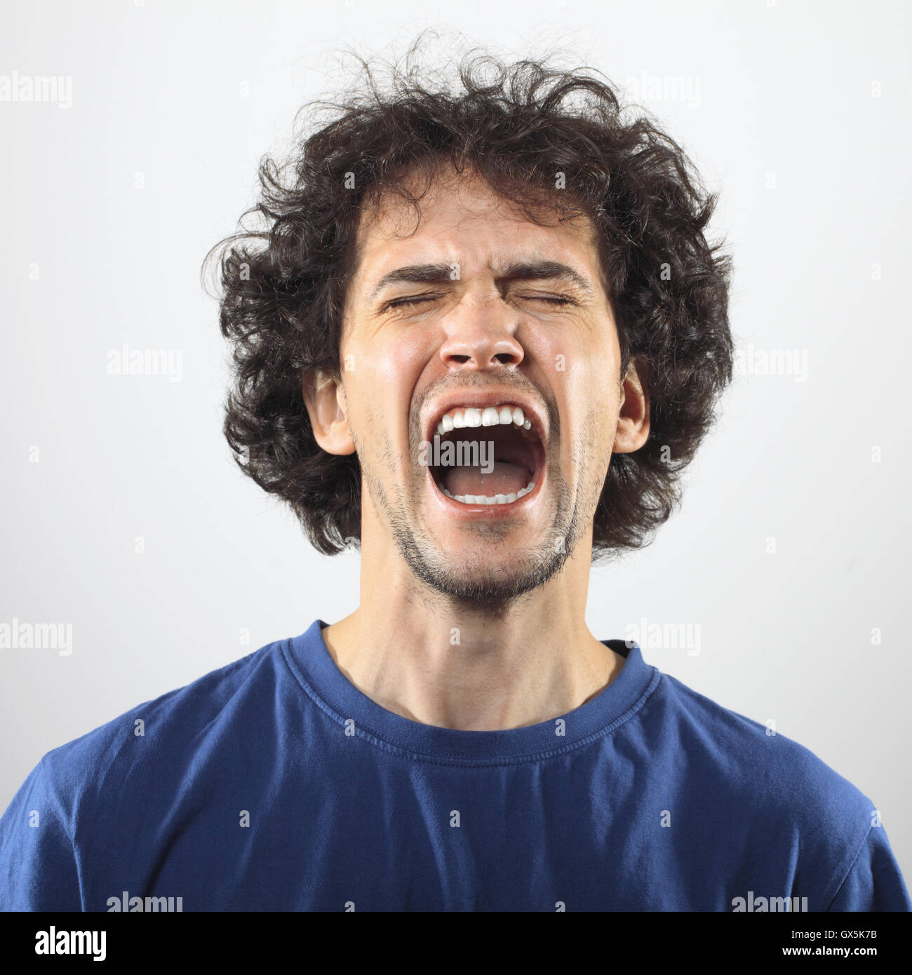 Furious and angry handsome young man portrait. Stock Photo