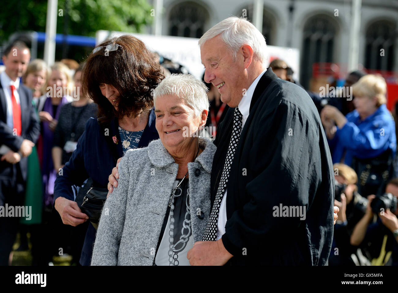 Gordon and Jean Leadbeater join MPs to view the floral display in