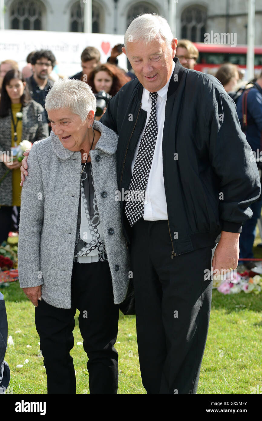 Gordon and Jean Leadbeater join MPs to view the floral display in