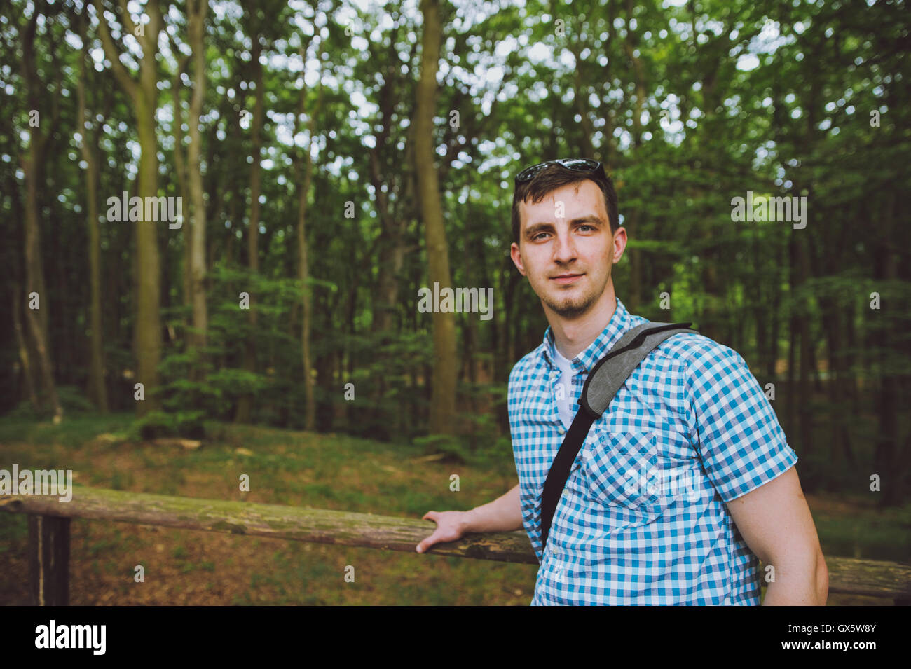 Young man on a walk in the forest. Stock Photo