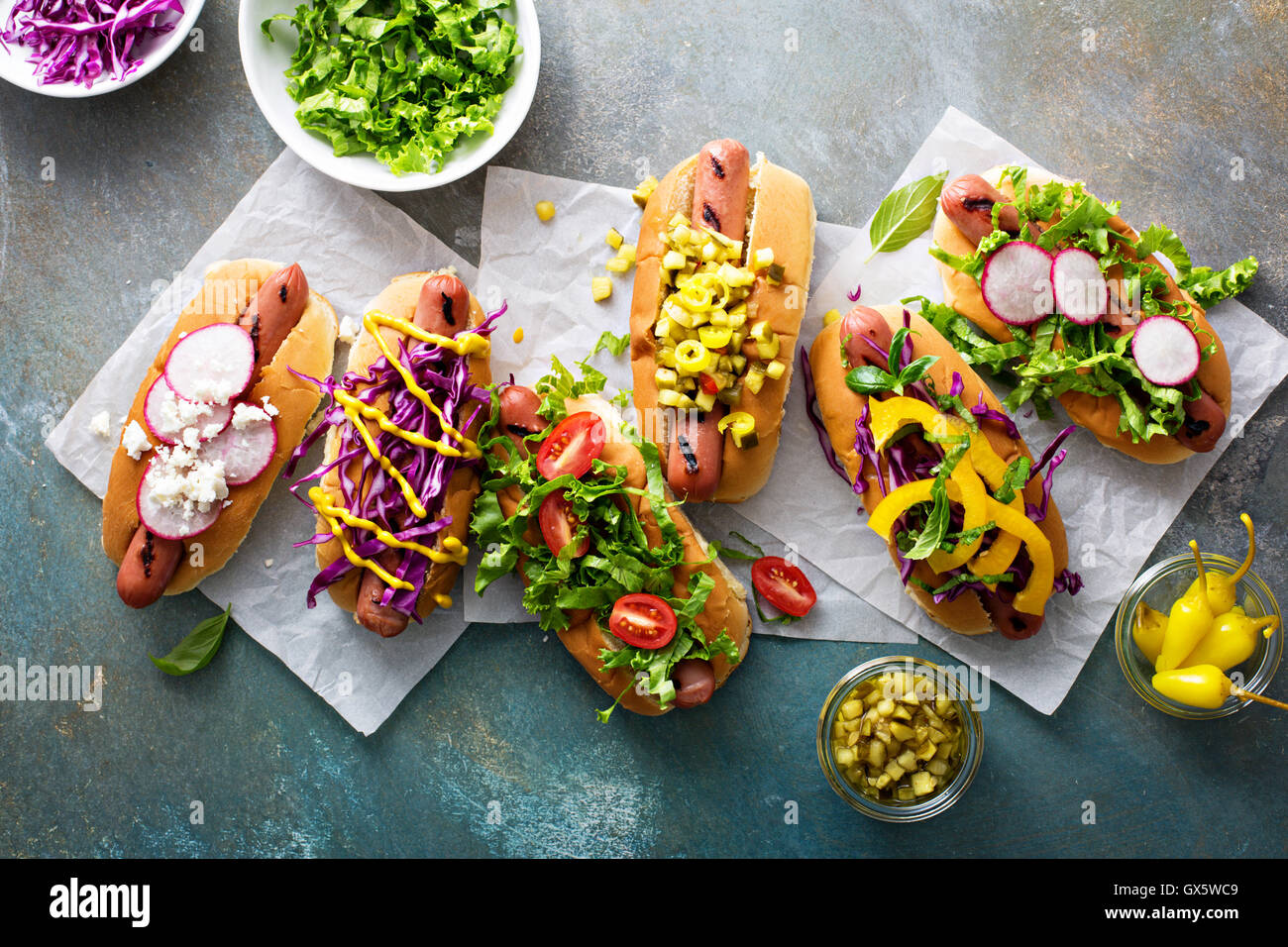 Variety of hot dogs with healthy garnishes Stock Photo