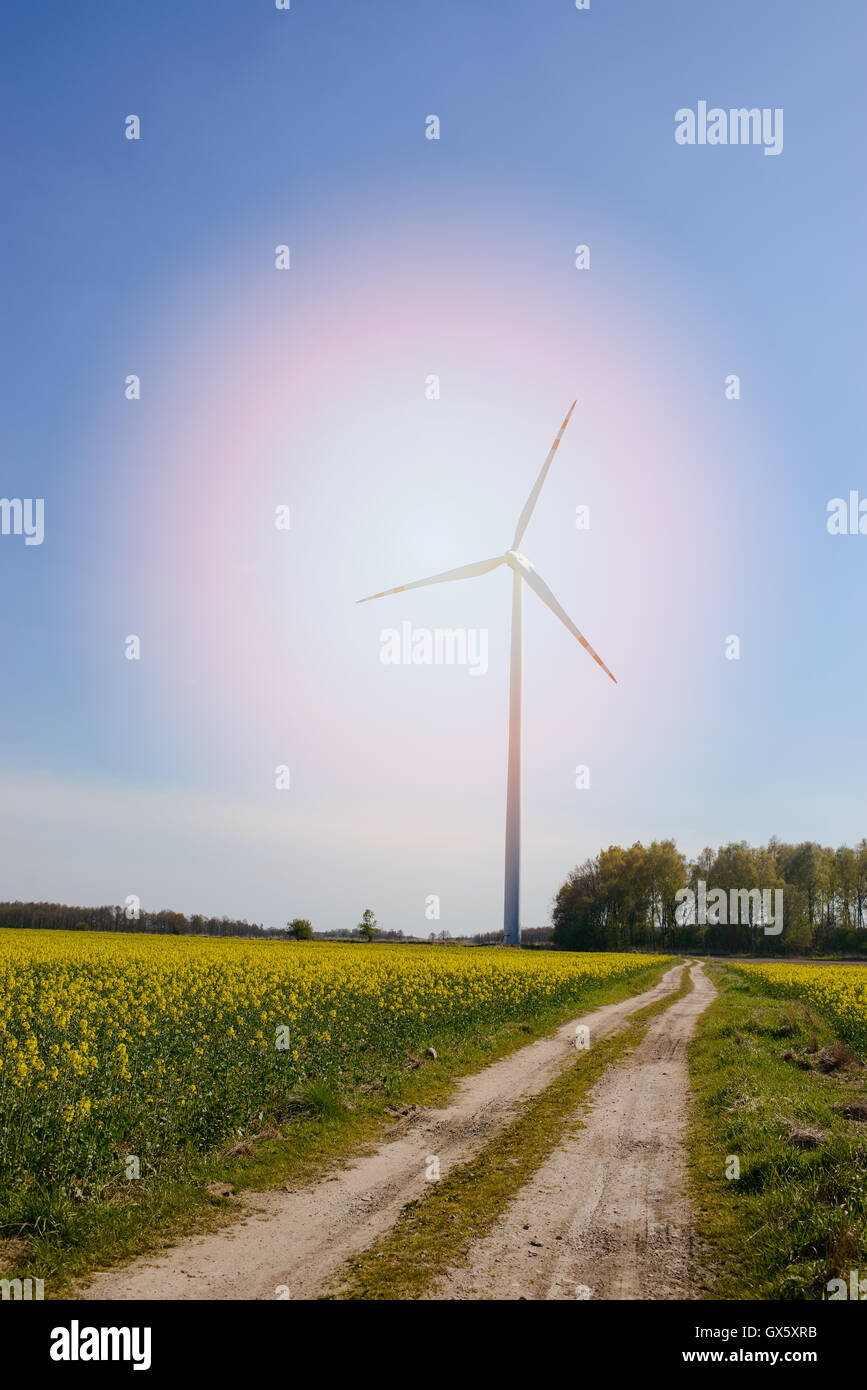 Bright blue sky moving and wind turbine. Stock Photo