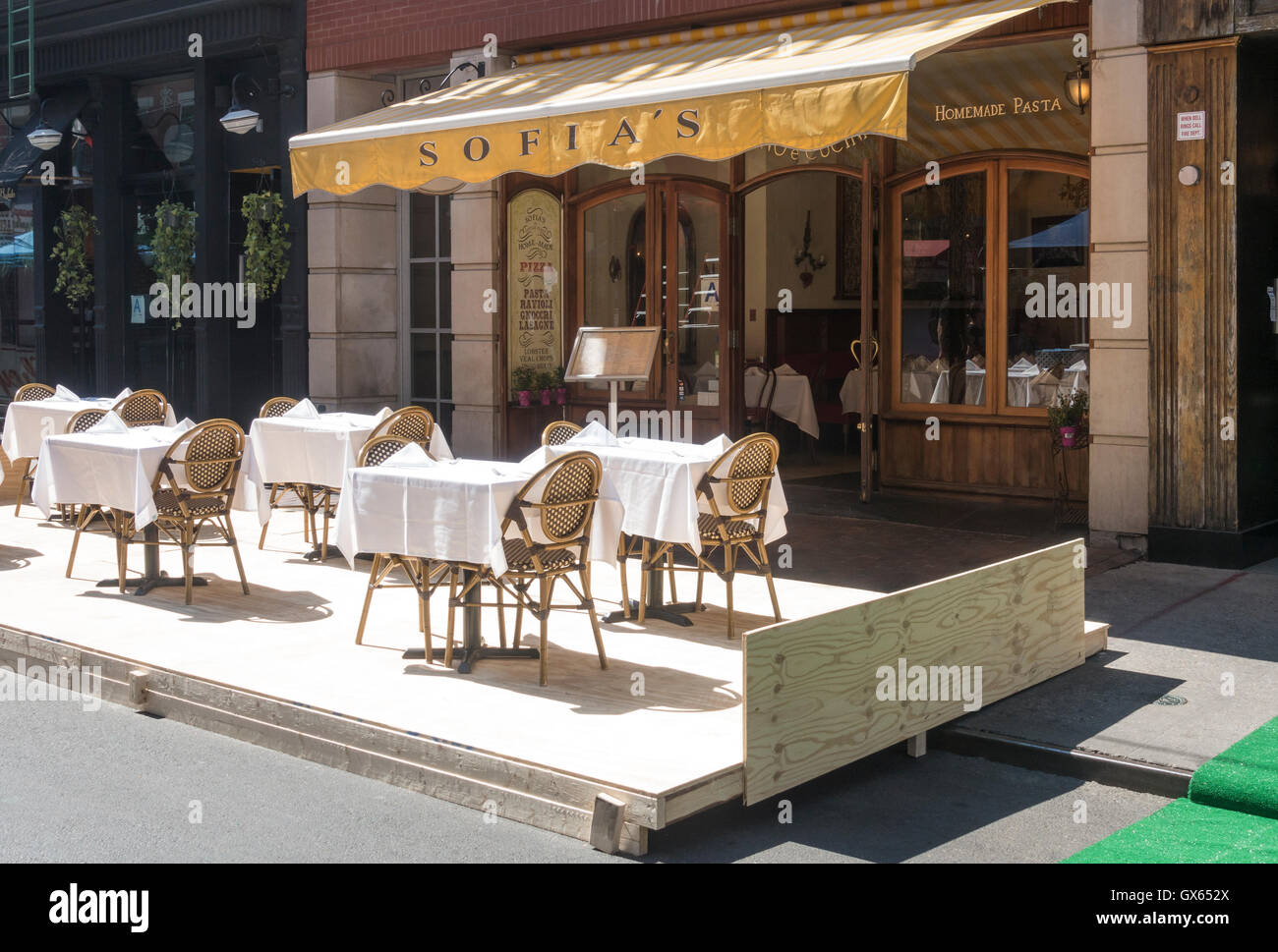 Sofia's Italian restaurant on Mulberry Street in Little Italy. The platform, when finished, is for San Gennaro Festival Stock Photo