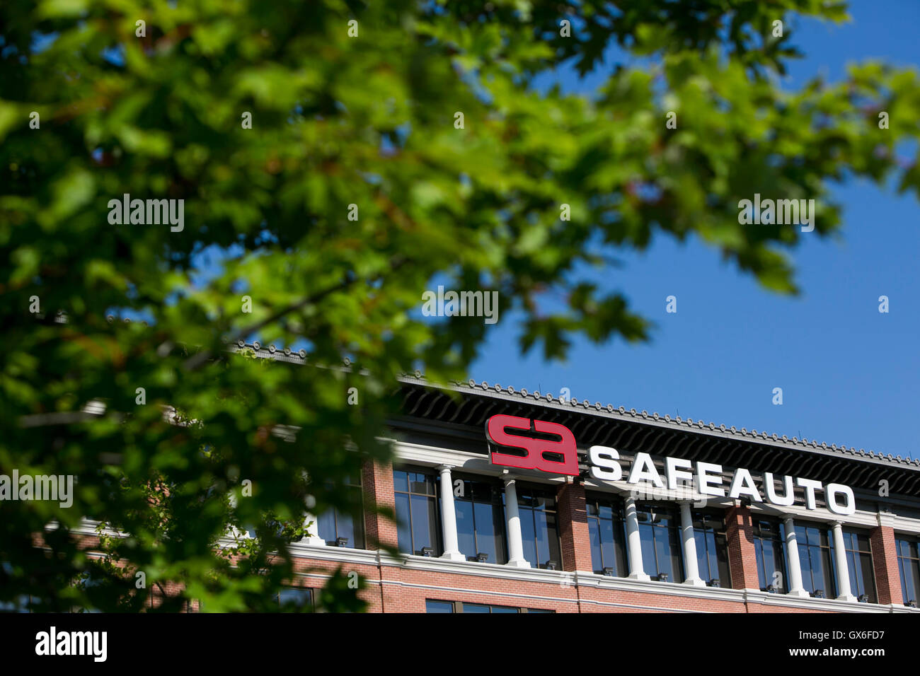 A logo sign outside of the headquarters of the Safe Auto Insurance